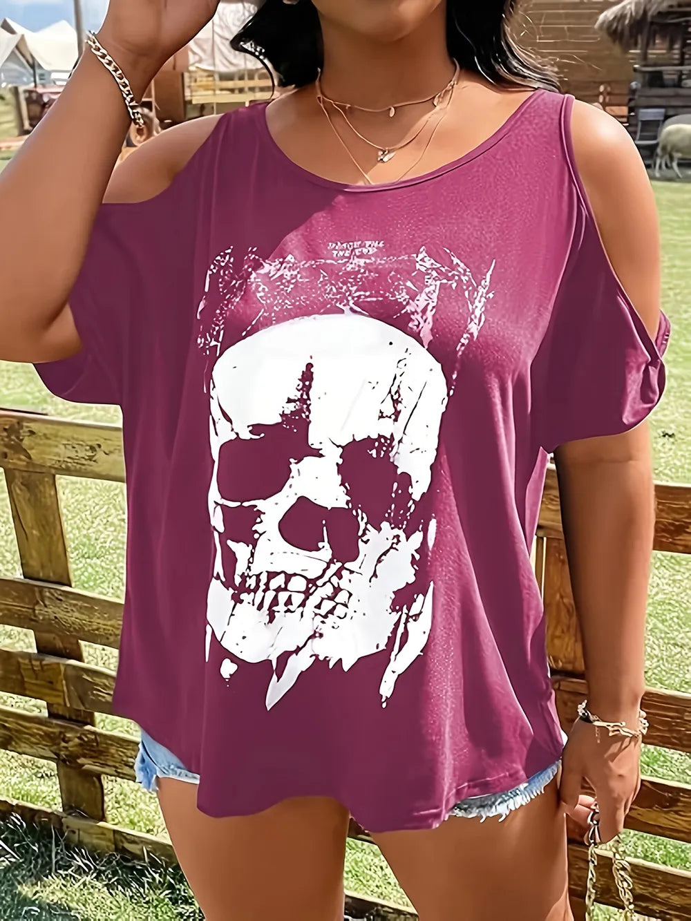 Plus size cold shoulder t-shirt with a white skeleton graphic on a maroon background.