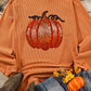 Orange ribbed sweatshirt with a sequined pumpkin design.