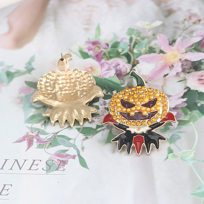 A pair of demon pumpkin rhinestone alloy earrings.