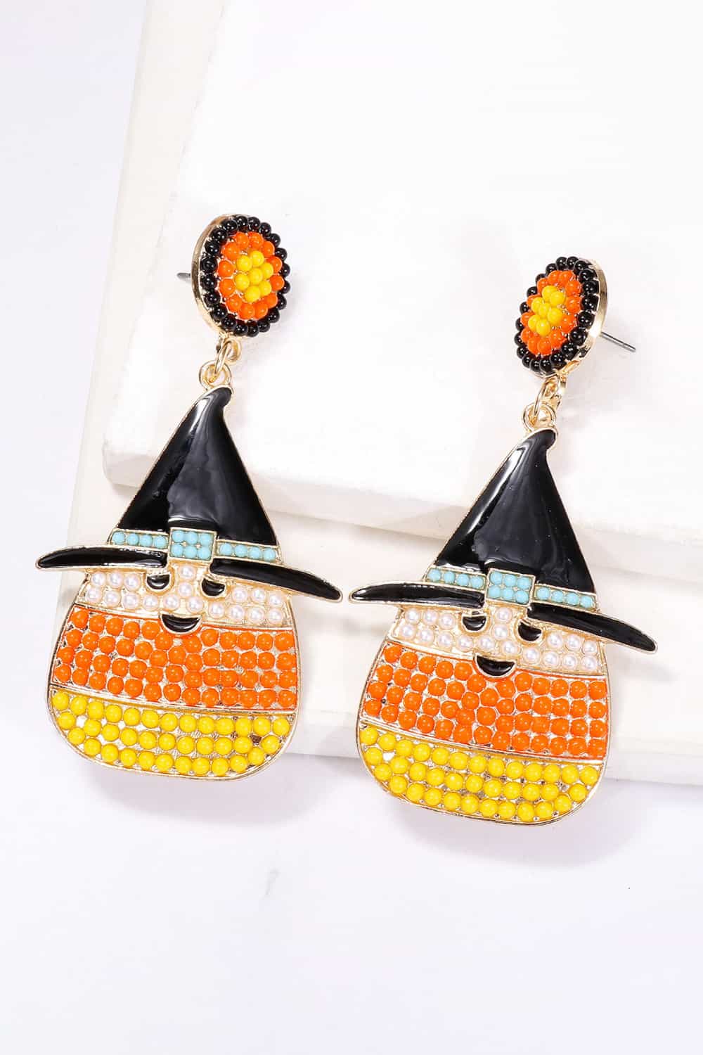 Witch's hat shape synthetic pearl dangle earrings with orange and yellow beads.