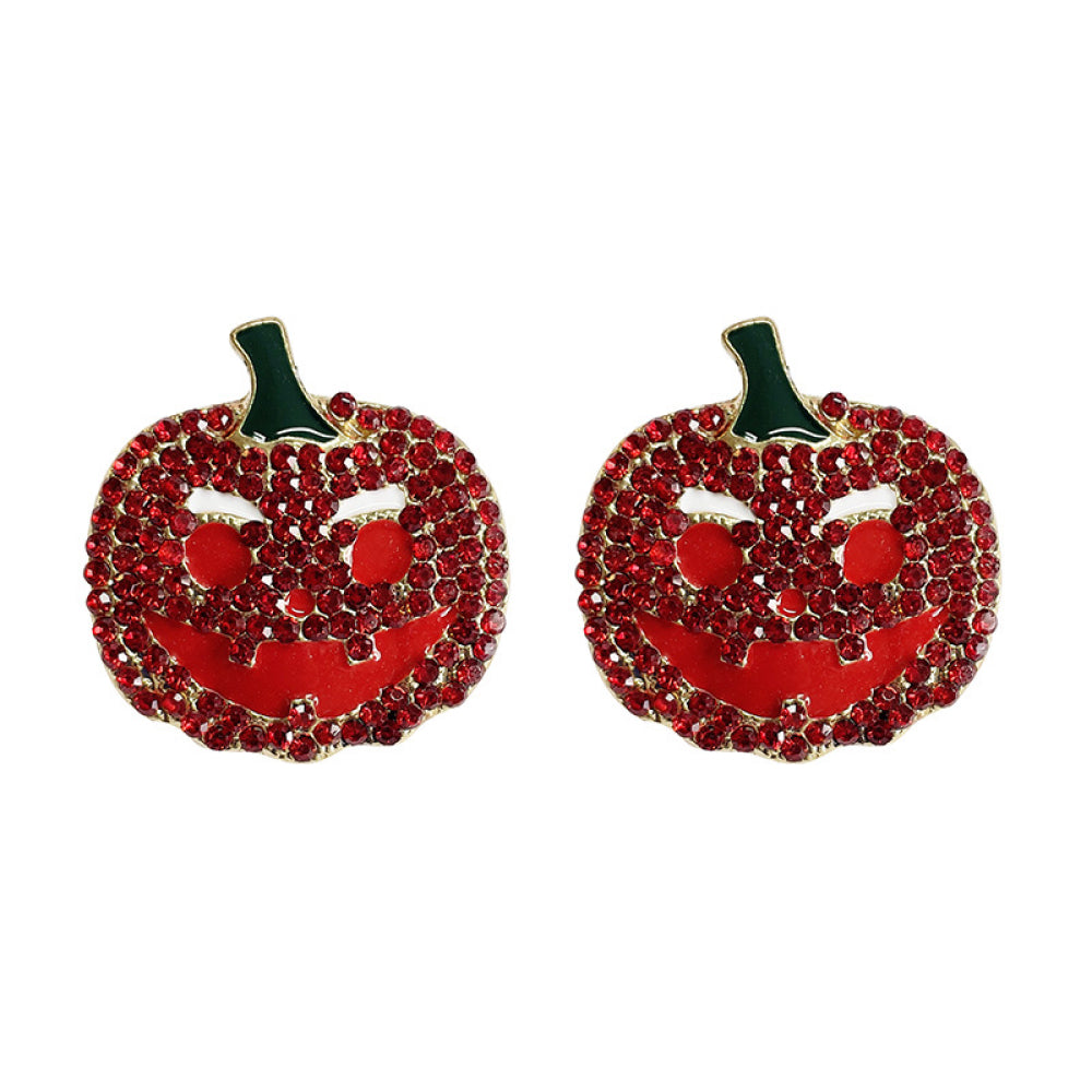 Two red rhinestone pumpkin earrings with green stems and carved faces.
