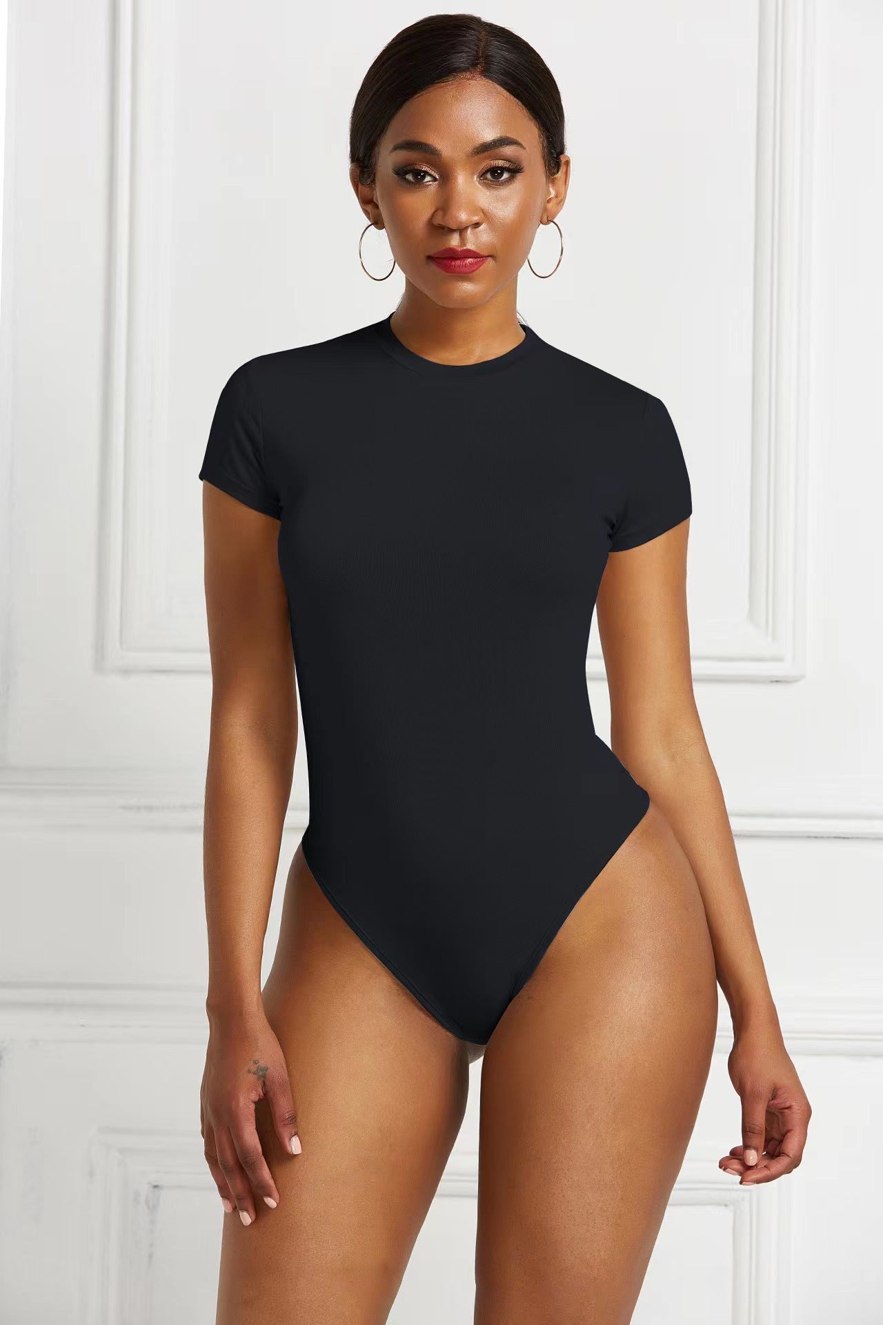 A base layer for a shaping garment