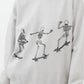 Oversized sweatshirt with three skeleton figures skateboarding across the front.