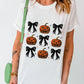 A woman wears a white short-sleeve t-shirt with a pumpkin and bow pattern.