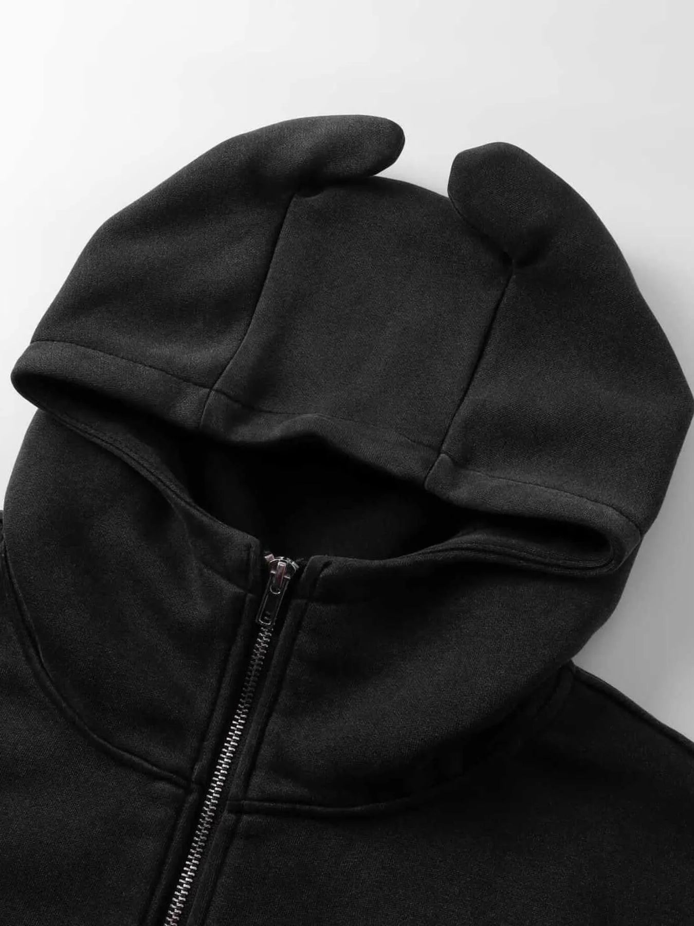 Men's black zip-up hoodie with devil horns on the hood.