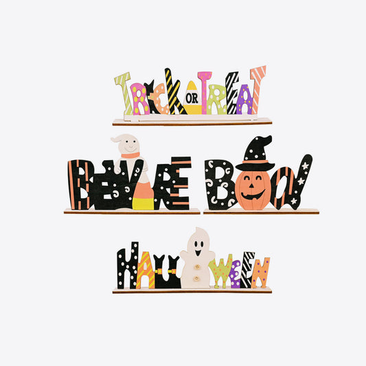 Three wooden Halloween signs with phrases "Trick or Treat," "Beware Boo," and "Halloween."