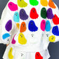 White long-sleeve top and shorts set with colorful ghost appliques.