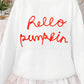 White long-sleeve sweater with "hello pumpkin" in red script.