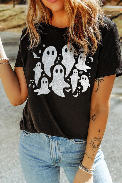 A woman wears a black short-sleeve t-shirt with a glittery ghost graphic.