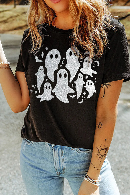 A woman wears a black short-sleeve t-shirt with a glittery ghost graphic.