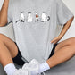 Gray short-sleeve t-shirt with a ghost cat graphic.
