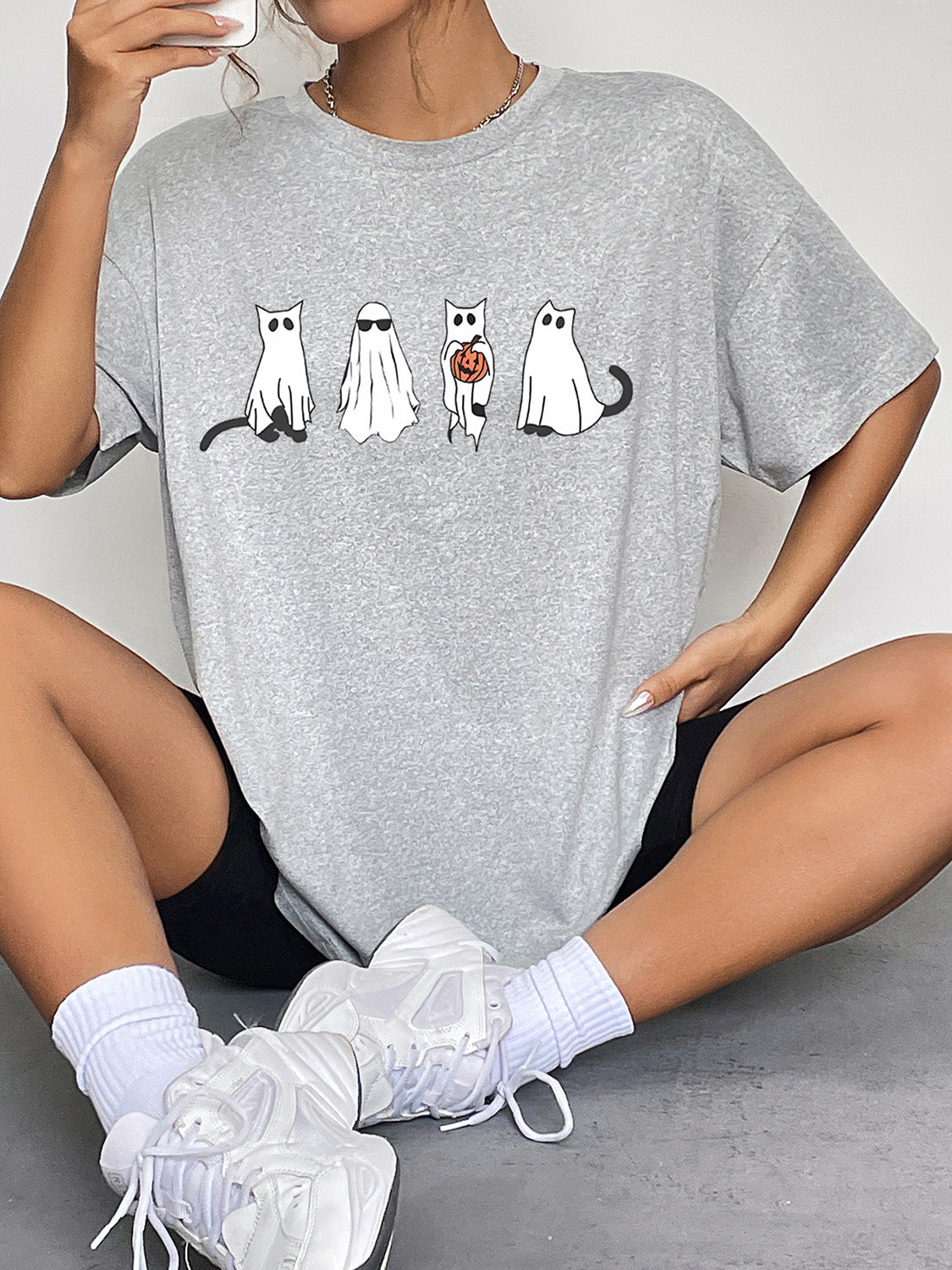 Gray short-sleeve t-shirt with a ghost cat graphic.