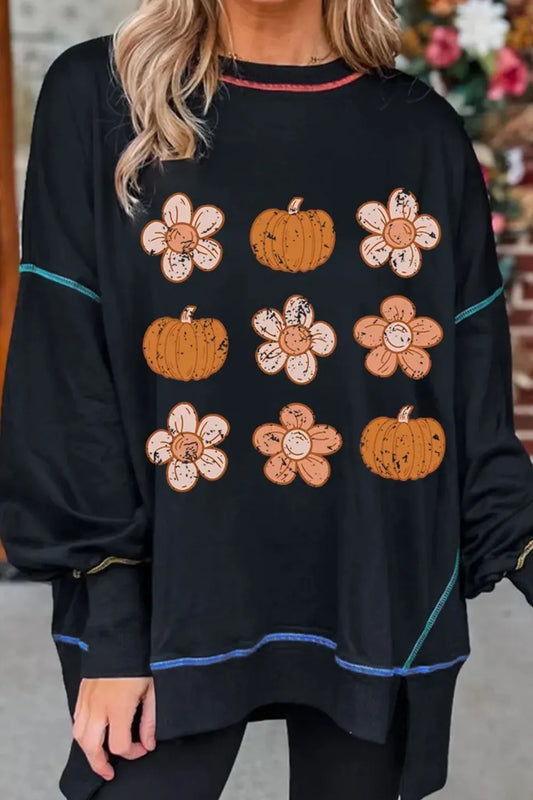 Black long-sleeve sweatshirt with pumpkin and flower graphics.