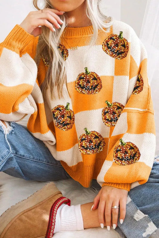 Pumpkin checkered round neck long sleeve sweater with sequin pumpkins.