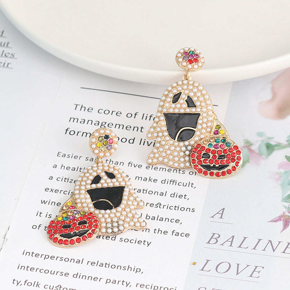 Ghost rhinestone alloy earrings with a pumpkin accent.