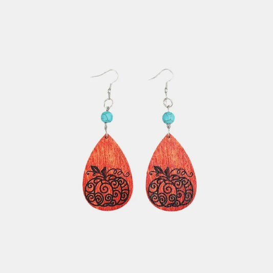 Turquoise wooden pumpkin teardrop earrings.