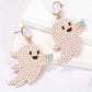 Ghost-shaped dangle earrings adorned with synthetic pearls and a "BOO" sign.
