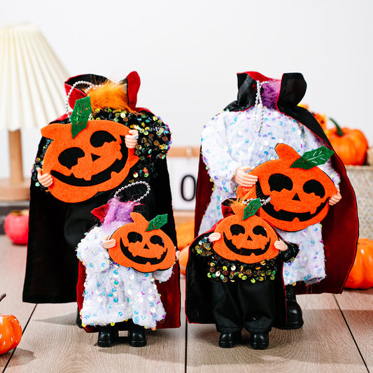 Two sequin Halloween hanging widgets, one large and one small, hold felt pumpkins.