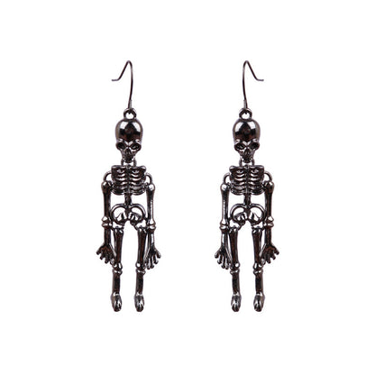 A pair of dark metal skeleton alloy earrings.