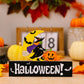A witch on a broomstick flying past a crescent moon, with "Halloween!" written below.