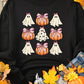 Black sweatshirt with a grid of pumpkins and ghosts, surrounded by autumn leaves.