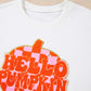 White long-sleeve sweatshirt with a large orange and pink checkered "Hello Pumpkin" patch.