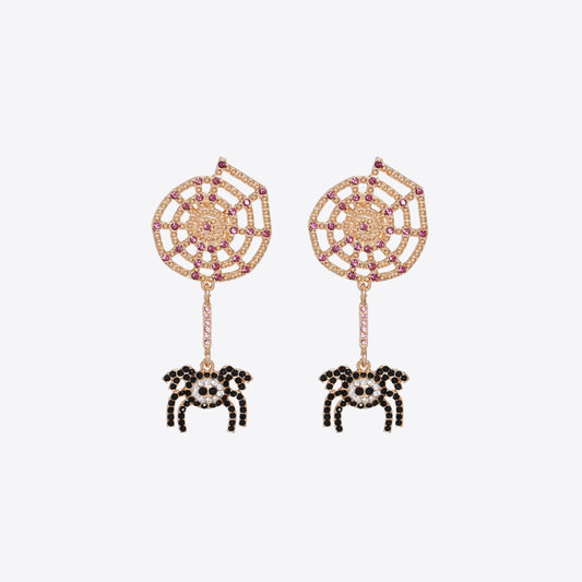 Gold-tone spiderweb earrings with pink and black rhinestones and dangling spiders.