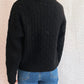 Pumpkin turtleneck long sleeve sweater with a cable-knit pattern.