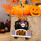 Four Halloween-themed wooden car-shaped hanging widgets with pumpkins, a gnome, and a black cat.