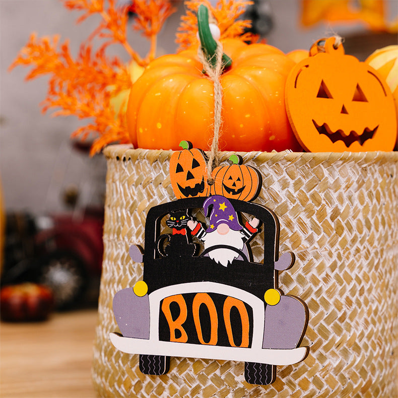 Four Halloween-themed wooden car-shaped hanging widgets with pumpkins, a gnome, and a black cat.