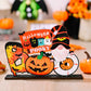 A Halloween-themed wooden ornament featuring a gnome, pumpkin, and "Spooky Halloween" text.