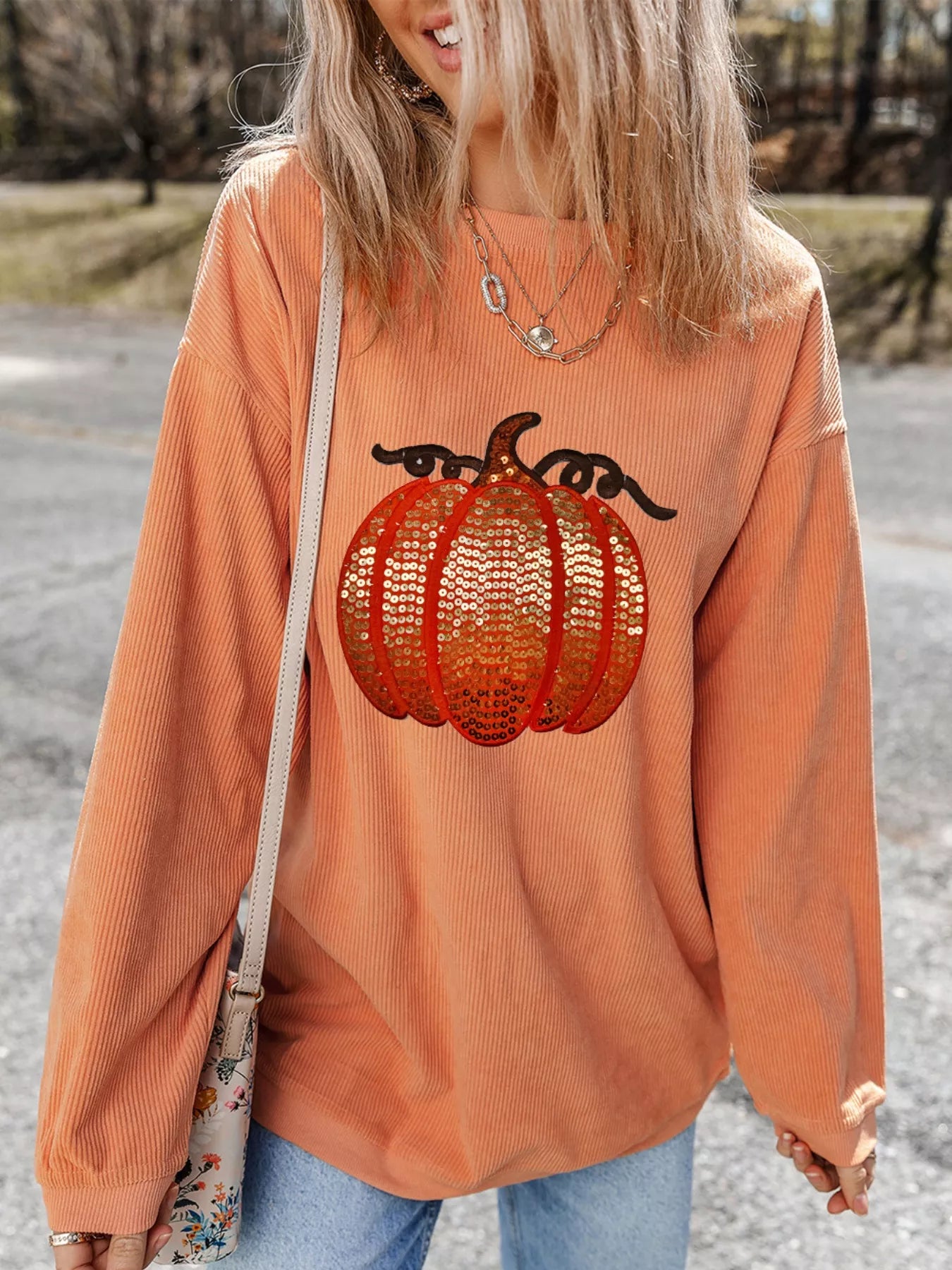 Halloween sequined pumpkin ribbed round neck sweatshirt.