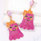 Smiling ghost shape synthetic pearl earrings with an orange bow.