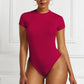 A base layer for a shaping garment