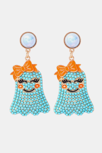 Smiling ghost shape synthetic pearl earrings with orange bows.
