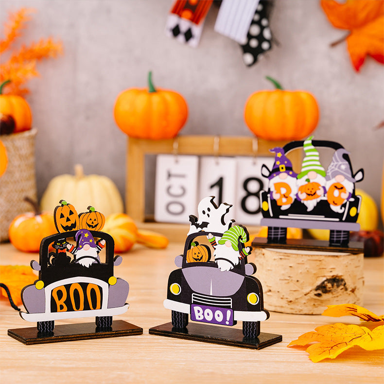 Three Halloween car-shaped ornaments featuring gnomes, pumpkins, and ghosts.