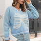 Skeleton pattern V-neck long sleeve pullover sweater in light blue.