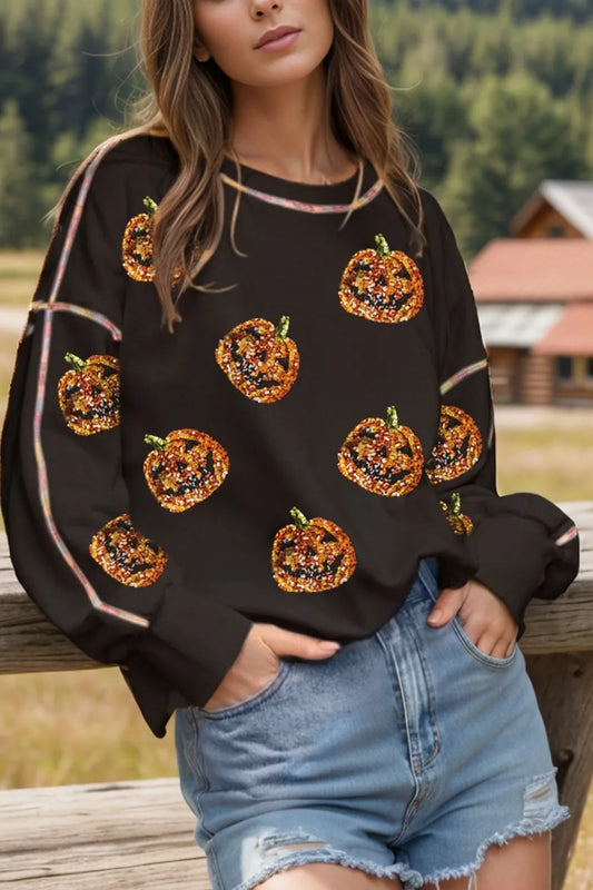Sequin pumpkin round neck long sleeve sweatshirt.