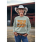 A woman in a cowboy hat wears a light green "Witch Way to the Candy" Halloween sweatshirt.