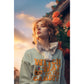 A woman wears a light blue "Witch Way to the Candy" Halloween sweatshirt.