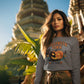A woman wears a gray Halloween Town sweatshirt with a pumpkin graphic.