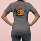 A person from behind wears a gray Halloween Town t-shirt with a pumpkin graphic.