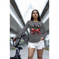 Spooky Cherry Halloween Bow Sweatshirt on a woman with a bicycle.