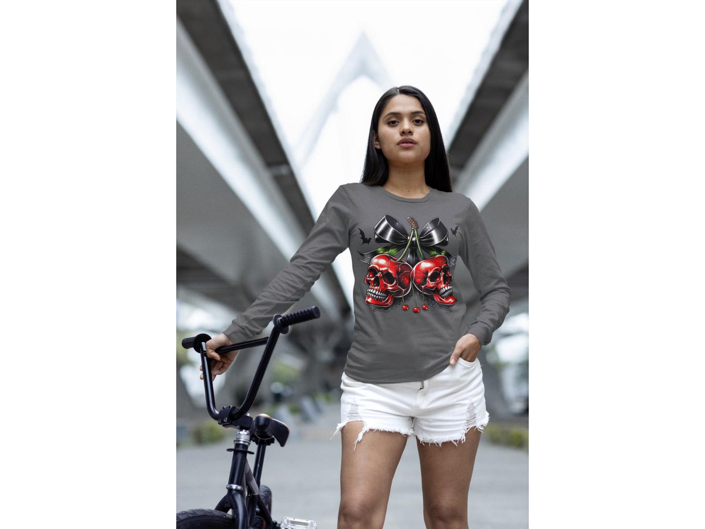 Spooky Cherry Halloween Bow Sweatshirt on a woman with a bicycle.
