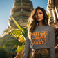 A woman wears a gray "Witch Way to the Candy" Halloween sweatshirt.