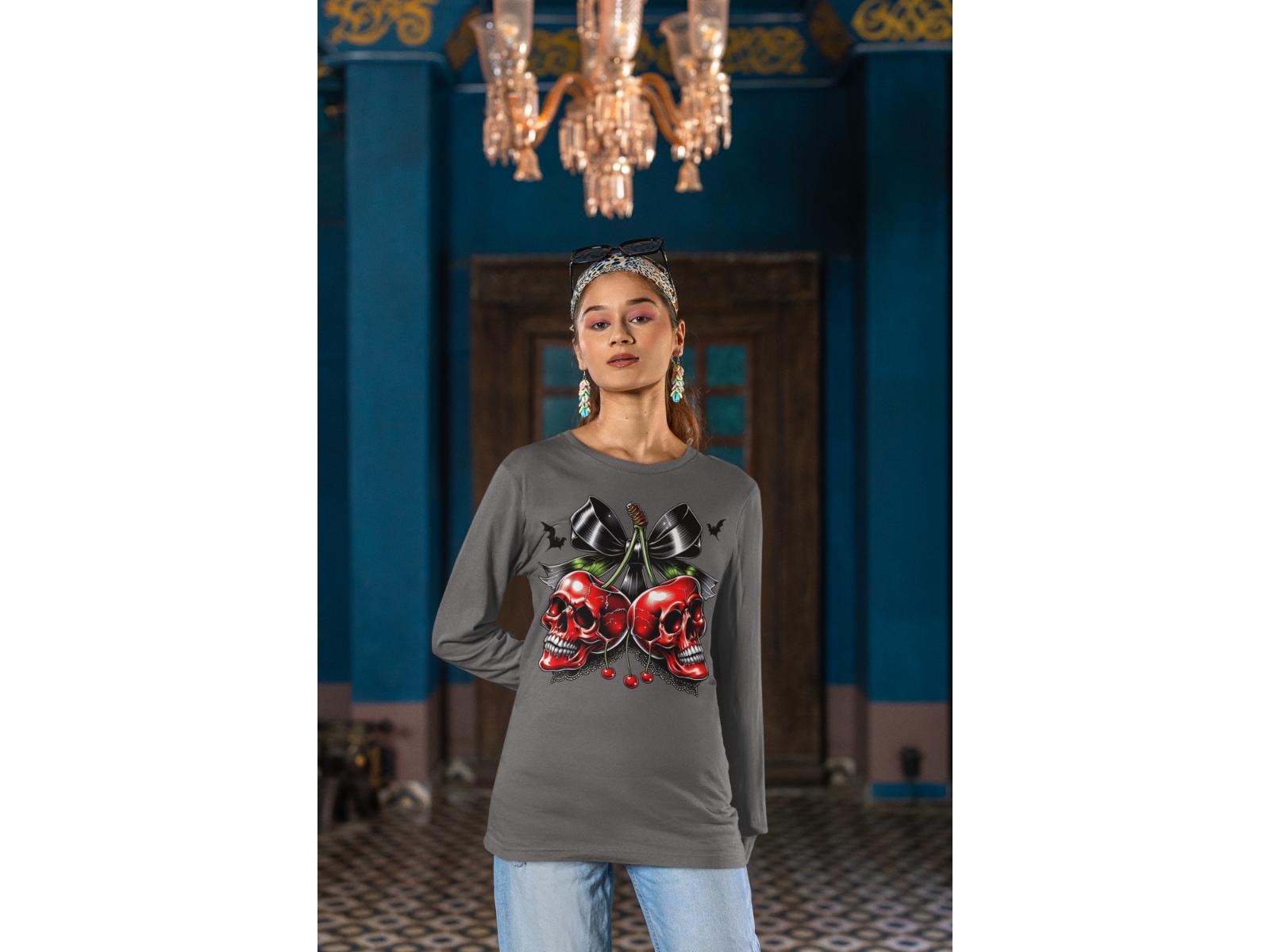 A woman wears a gray long-sleeve shirt with a spooky cherry and bow design.