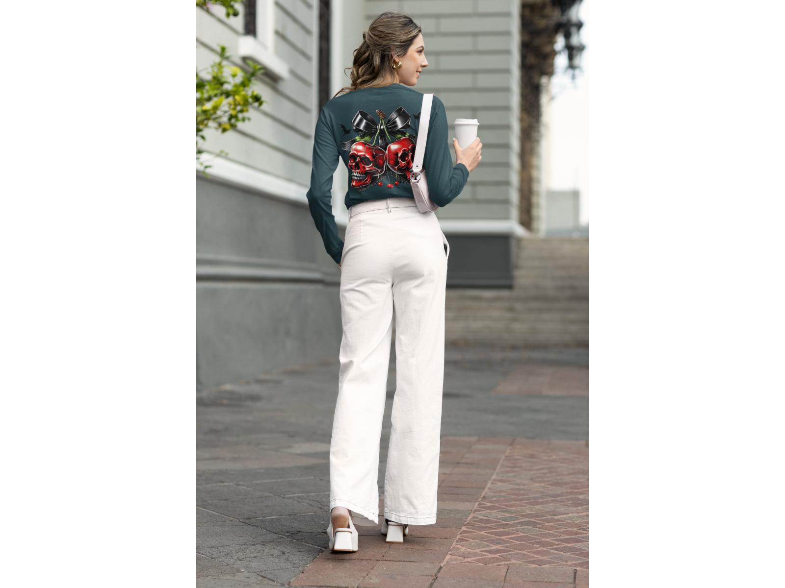 A woman from behind wears a dark green sweatshirt with a spooky cherry design.
