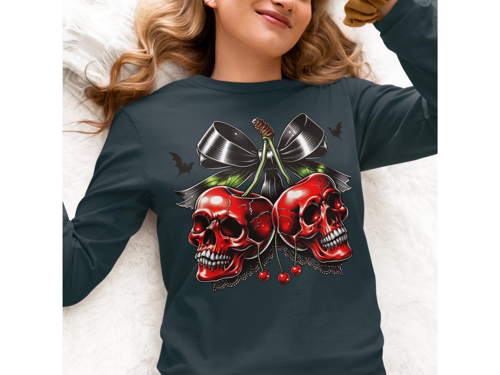A woman wears a dark long-sleeve shirt with a spooky cherry and skull design.