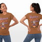A woman models the front and back of a brown "Baddest Witch in Town" t-shirt.