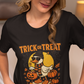A woman in a beige cap and black t-shirt with a Halloween duck graphic.
